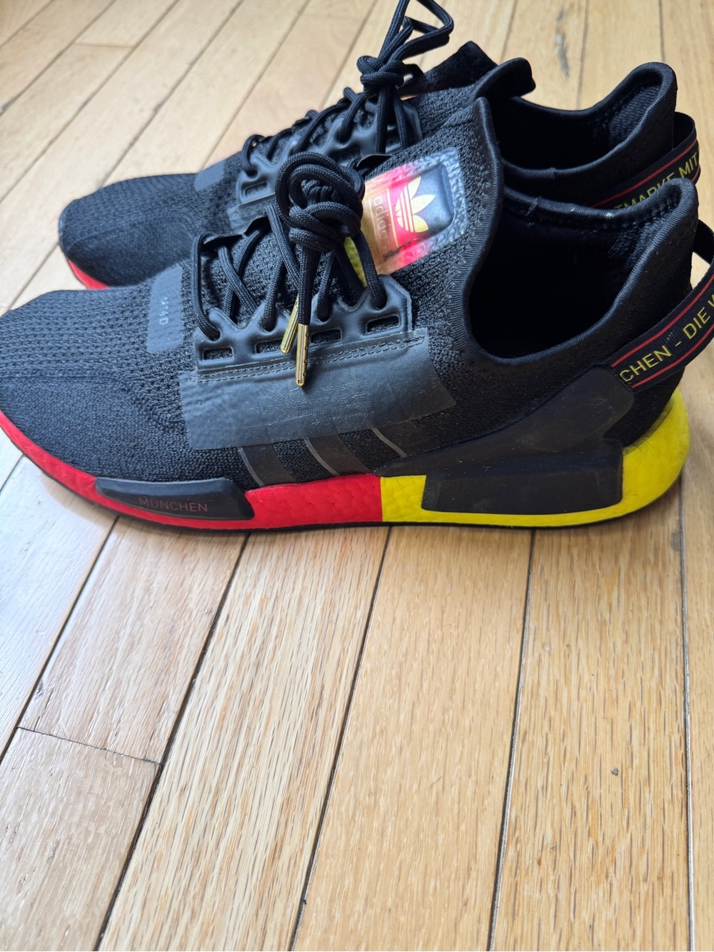 adidas Men’s Black Sneakers with Red & Yellow Midsole Accents